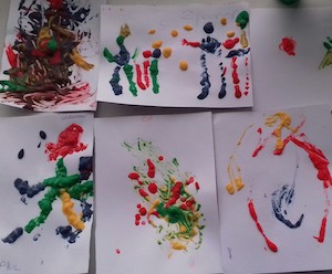 Photograph of children's puff paint pictures created at Starting Point Montessori School