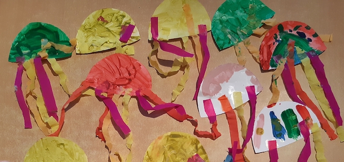 Photograph of paper jellyfish with tentacles created by children at Starting Point Montessori School